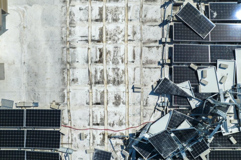Solar Panel Recycling - Top view of destroyed by hurricane Ian photovoltaic solar panels